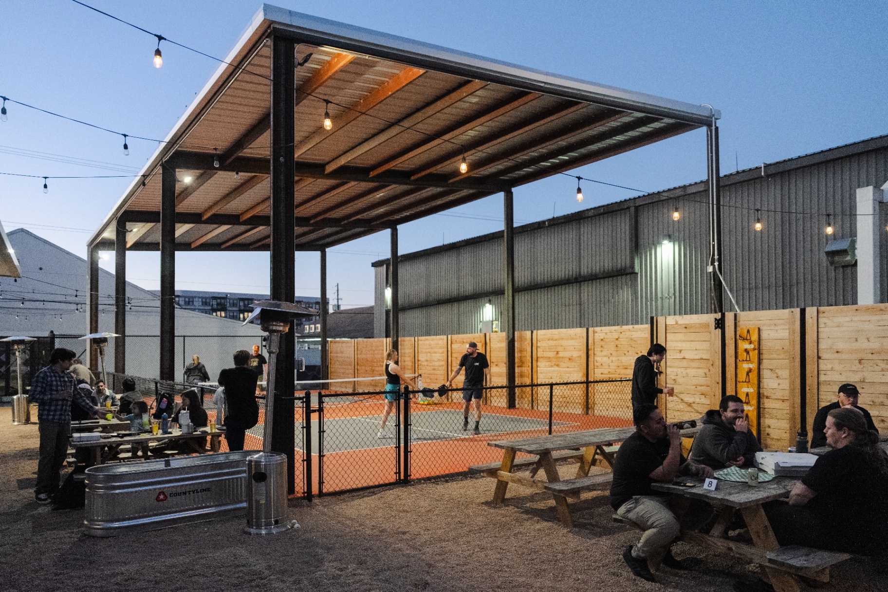 Outdoor pickleball courts at Ants Beer Cave during the day
