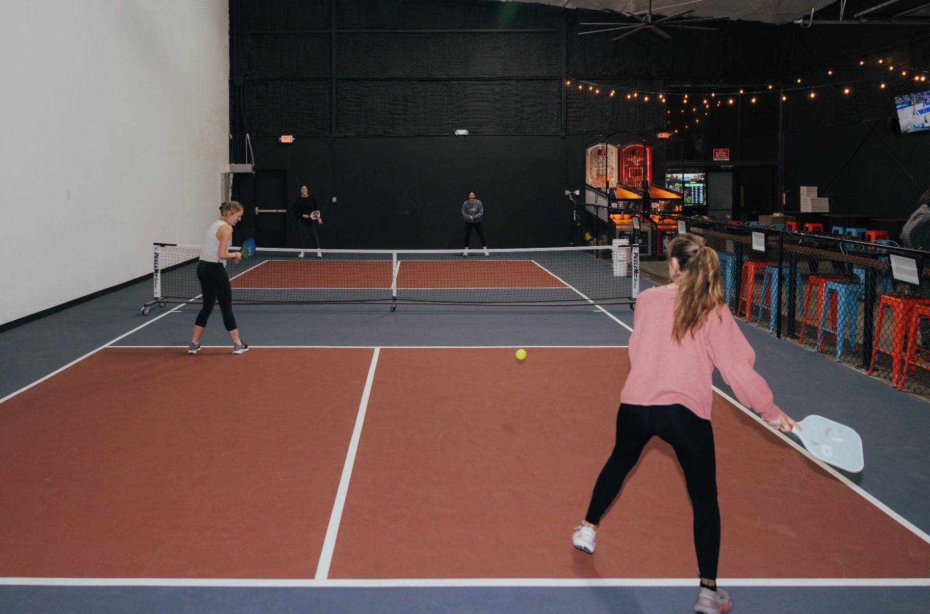 Indoor pickleball court doubles rally inside the Ants warehouse